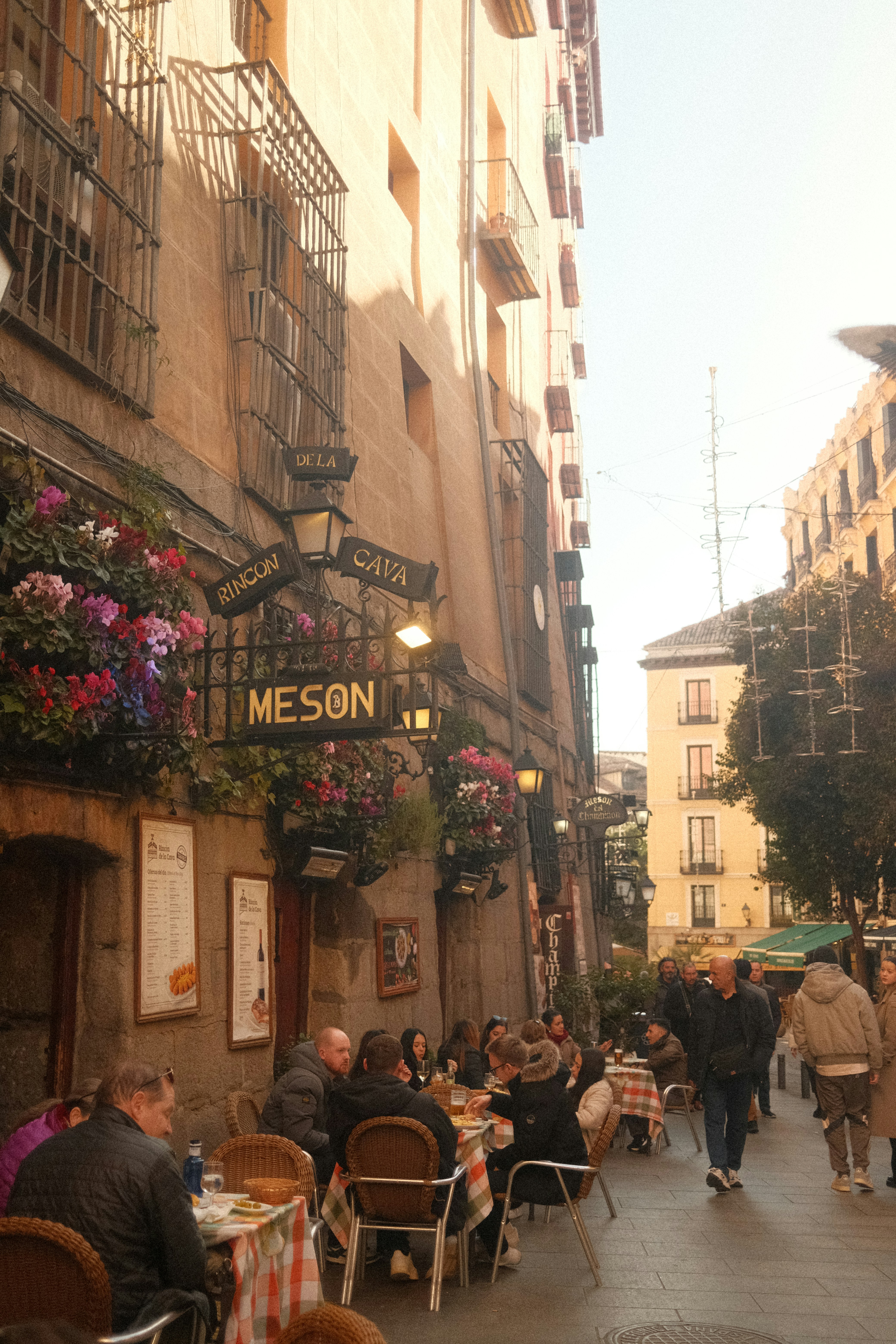 Outdoor restaurant in a charming, narrow city street.