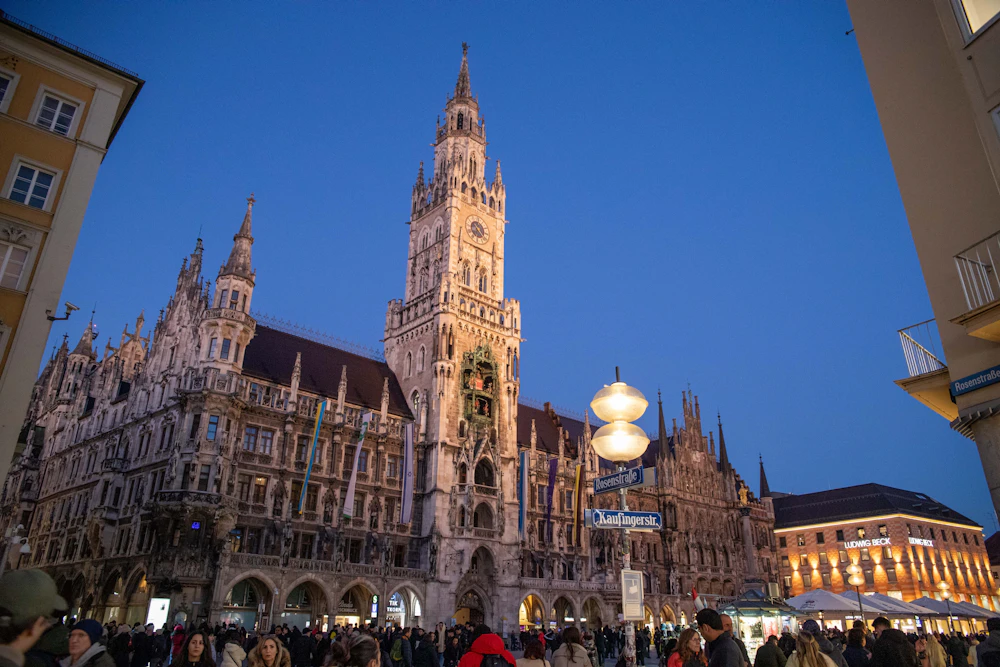 The Munich New Town Hall at dusk, near our registered office