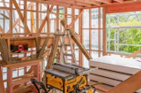 Construction site showing wood framework and tools.