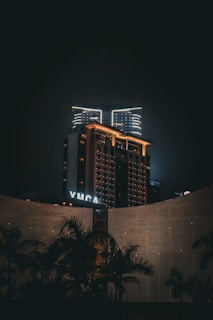 The ymca building is lit up at night.
