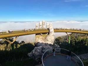 Golden bridge, held by giant hands in vietnam.