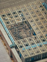 Antenna towers and grid-like building roof.