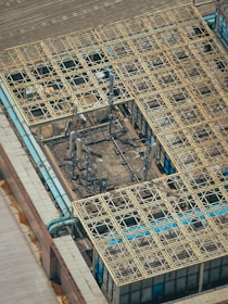 Antenna towers and grid-like building roof.