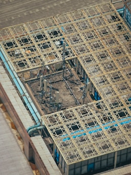 Antenna towers and grid-like building roof.