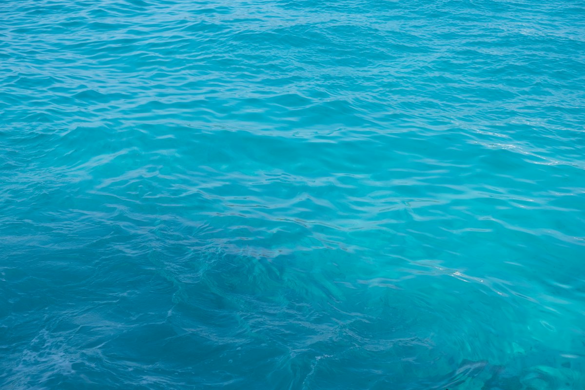 Beautiful calm blue water with gentle waves ideal for swimming