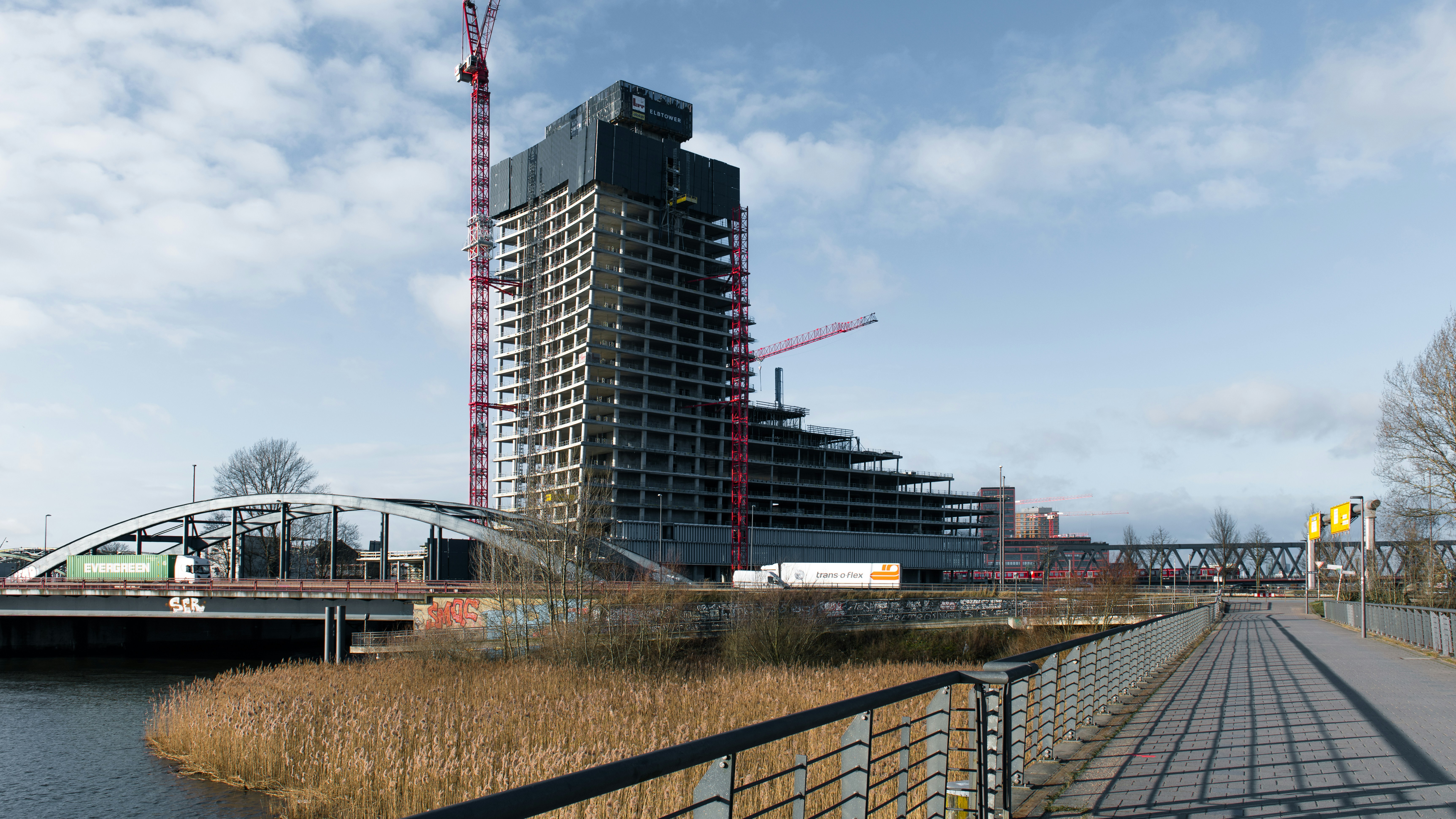 Construction of a tall building on the water.