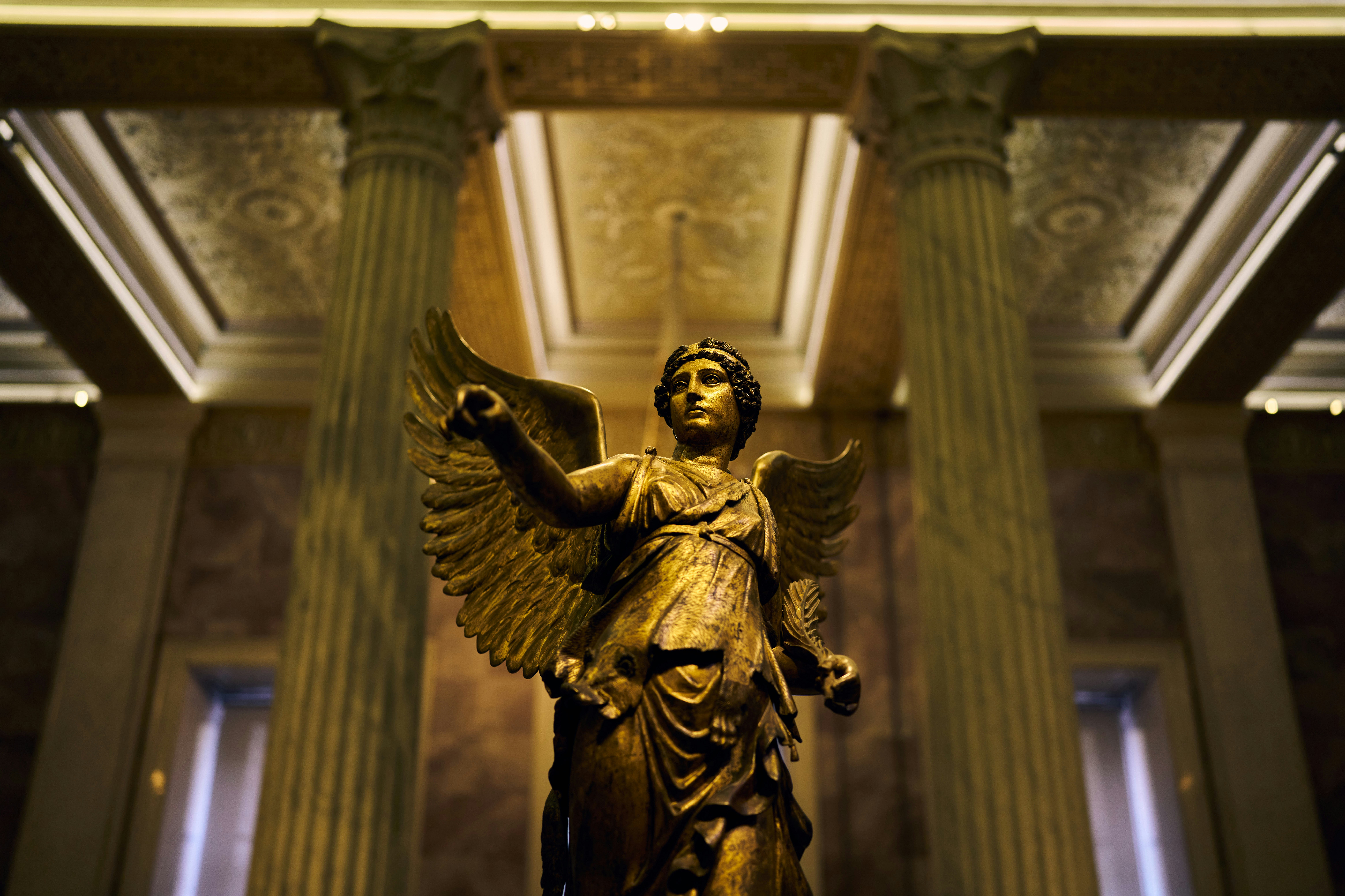 A golden angel statue is the focal point.