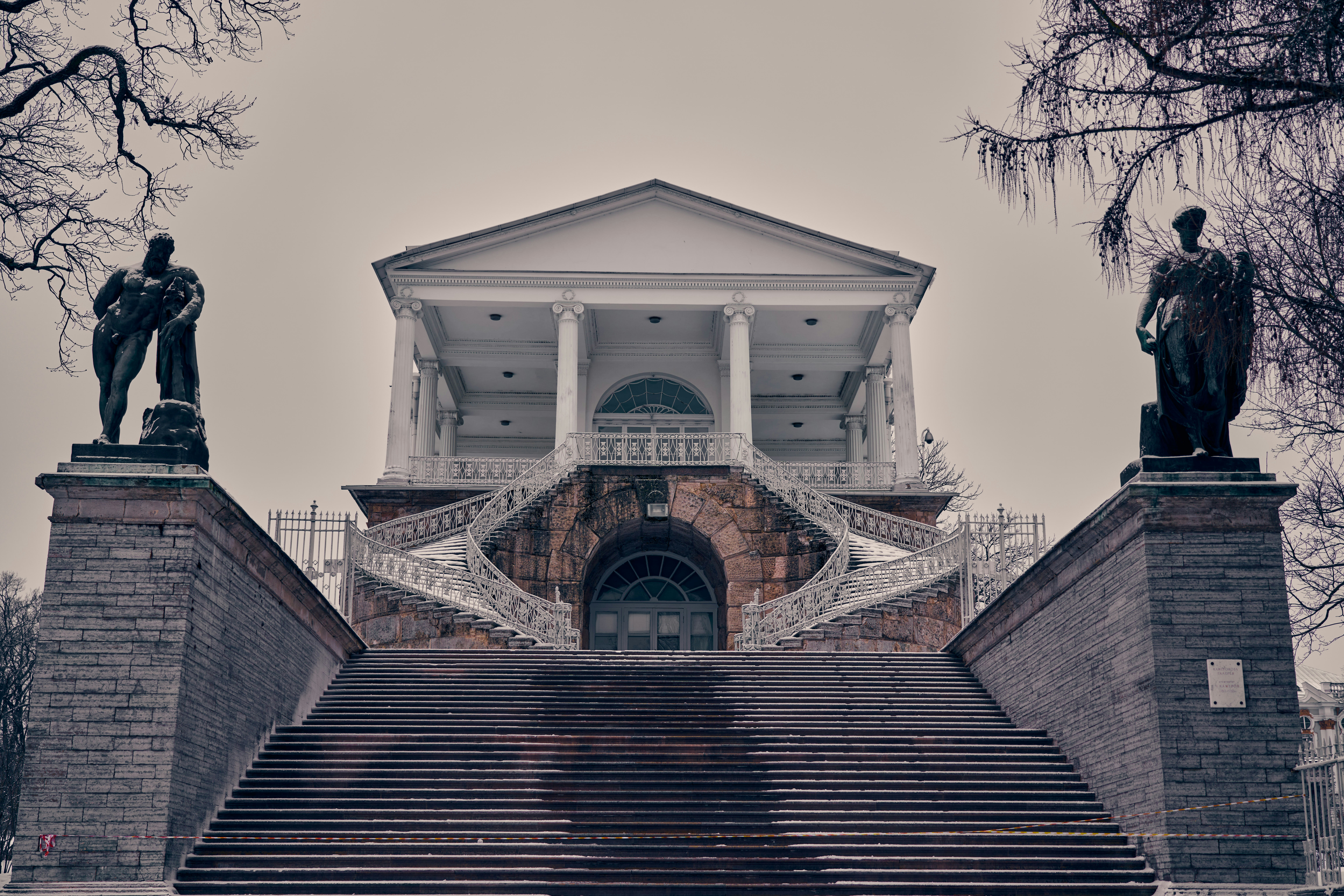 Grand architecture with sculptures and a staircase.
