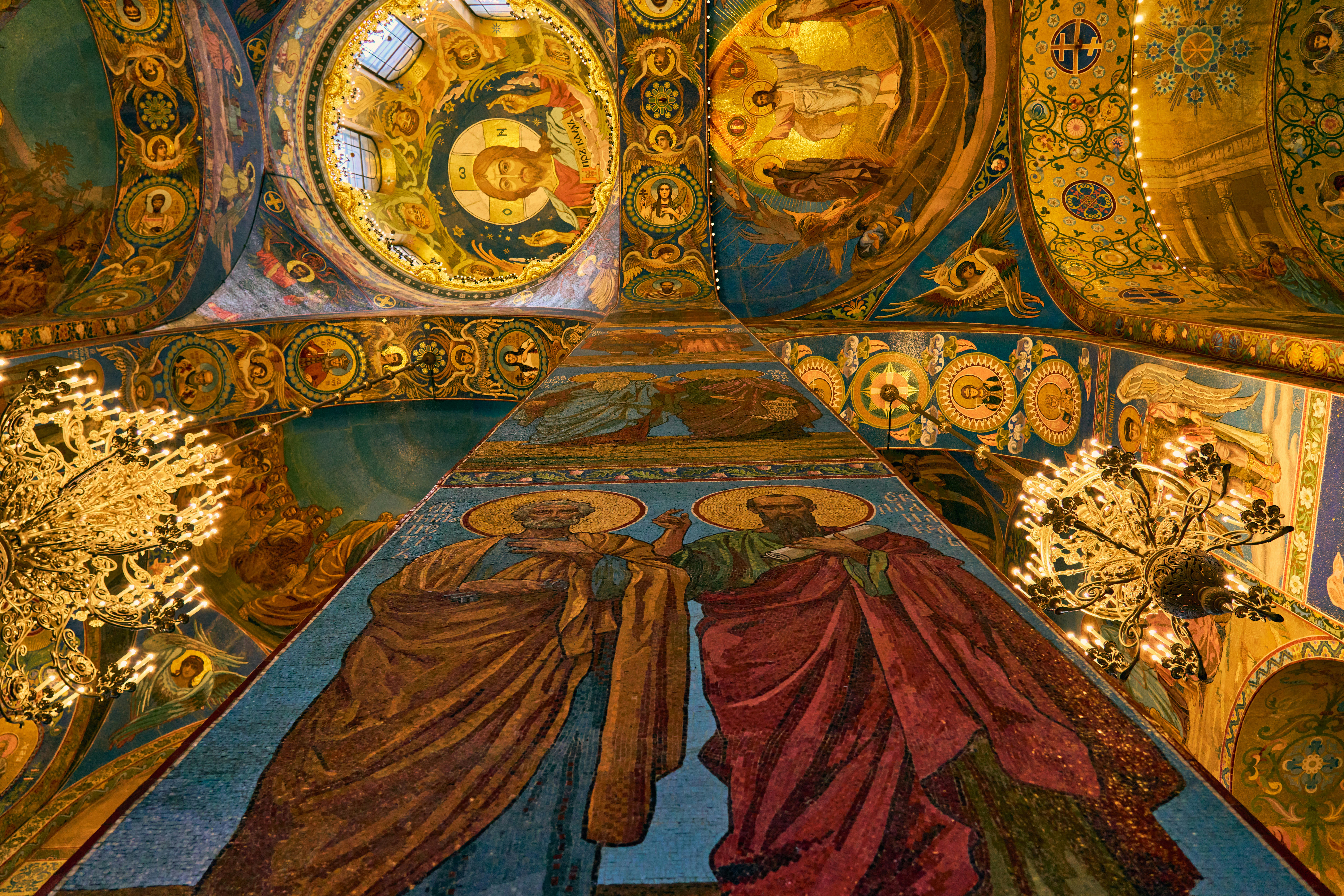 Inside of a colorful, ornate cathedral.