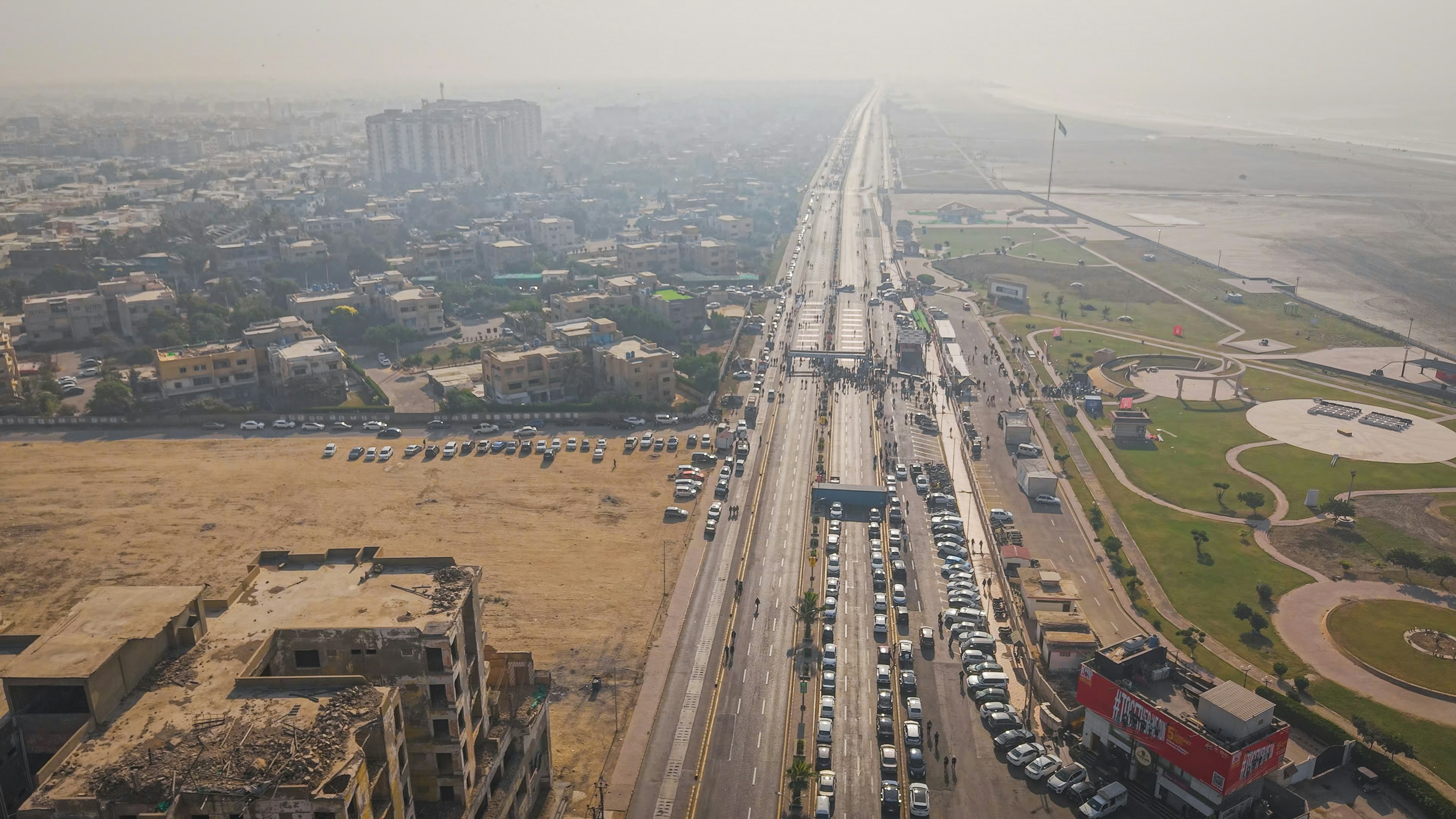 Vibrant city life captured from above, with cars and buildings in focus.