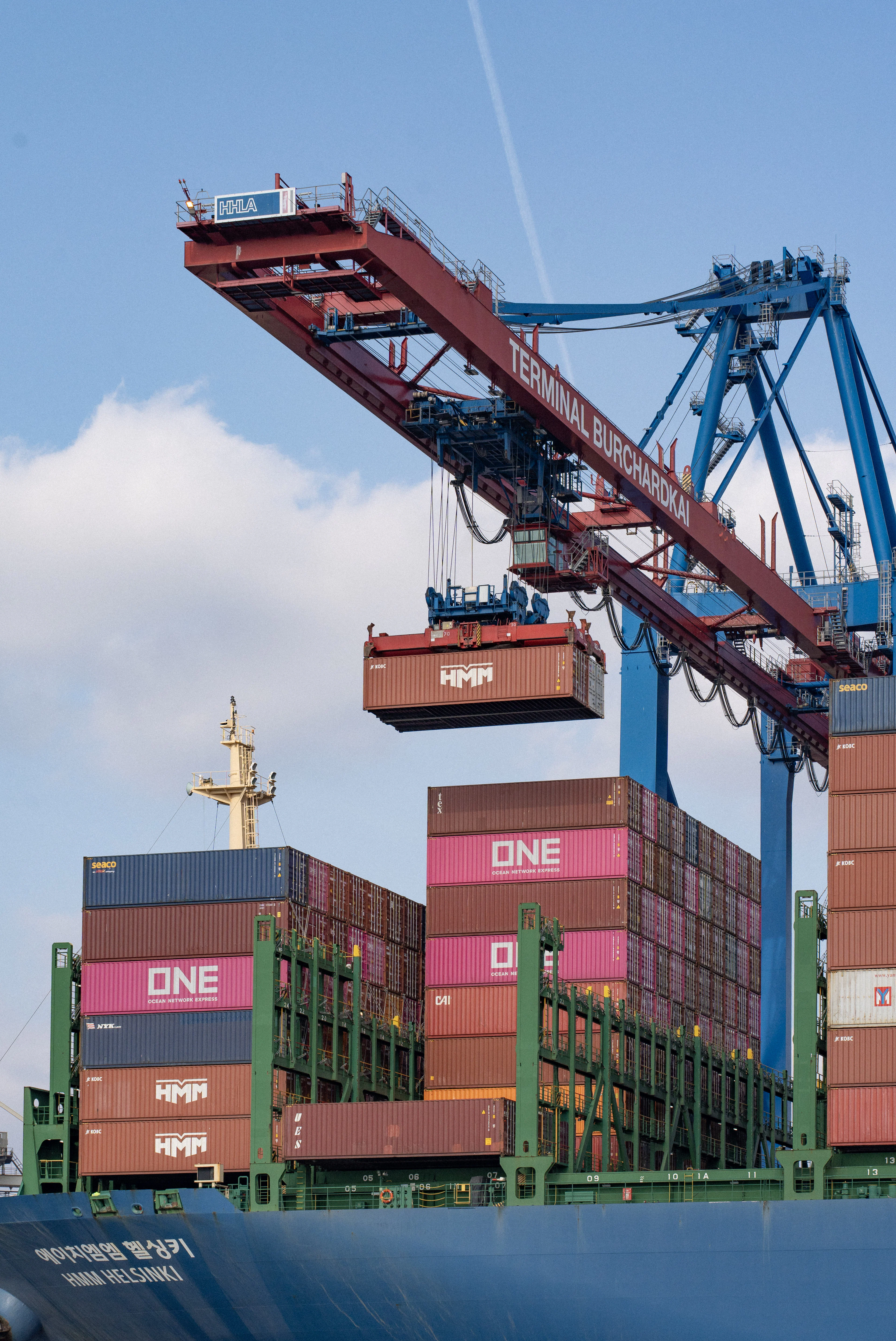 Gantry crane loading containers onto a vessel
