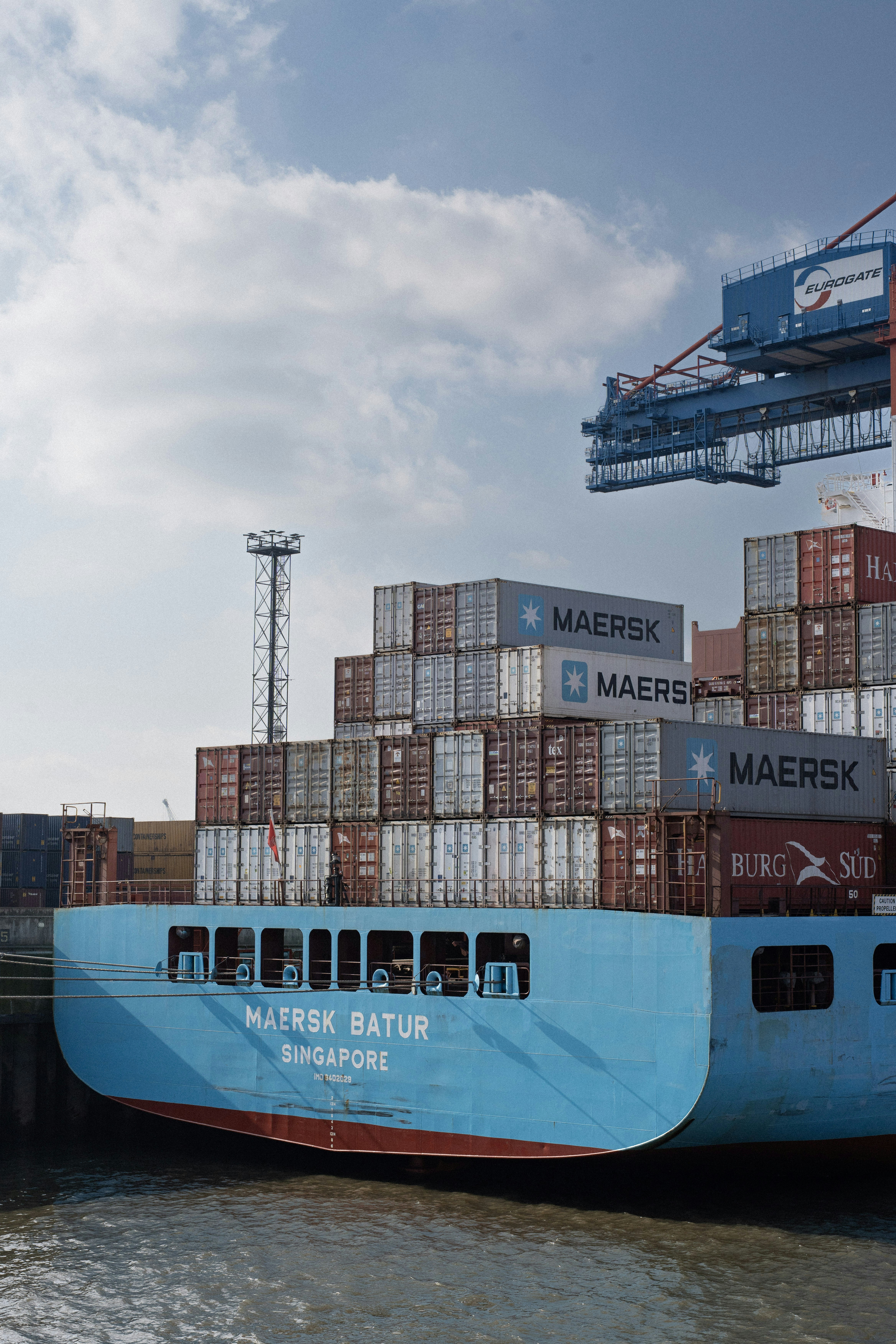 A maersk ship loaded with cargo containers.