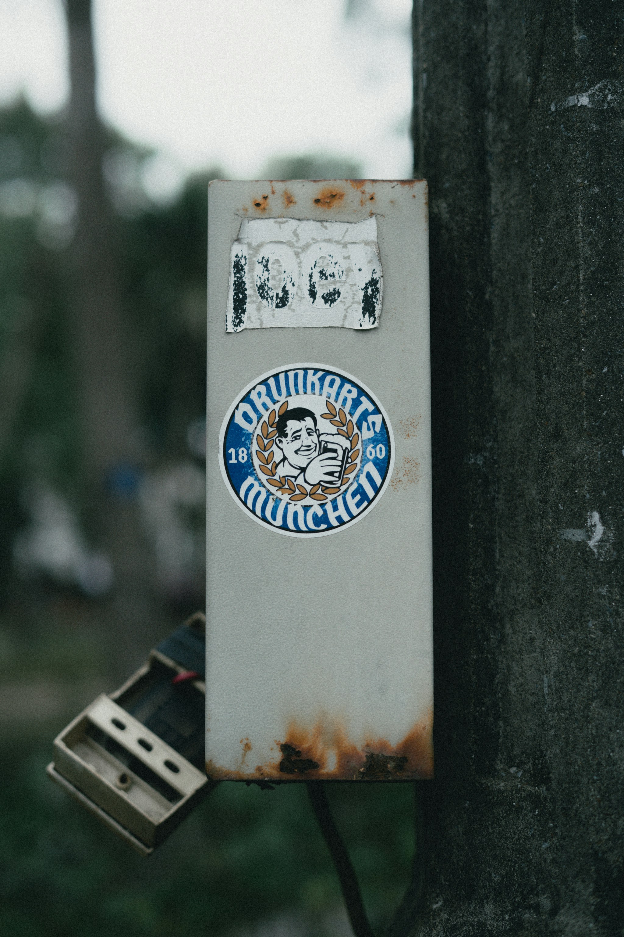 Stickers on a metal box; munich theme.