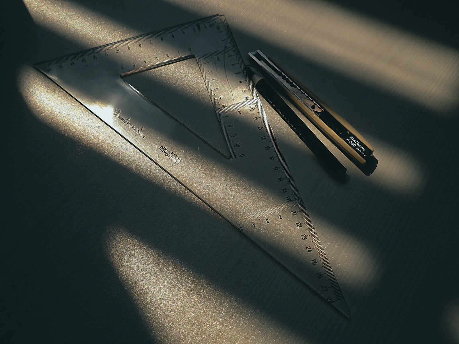 A ruler and blade in sunlight — the precision a UHNW estate manager is paid for but rarely given a framework for