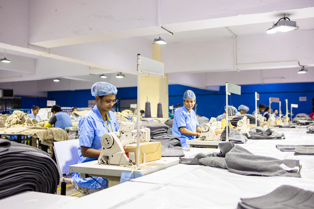 custom sportswear manufacturer Pakistan Urban Flair factory workers sewing
