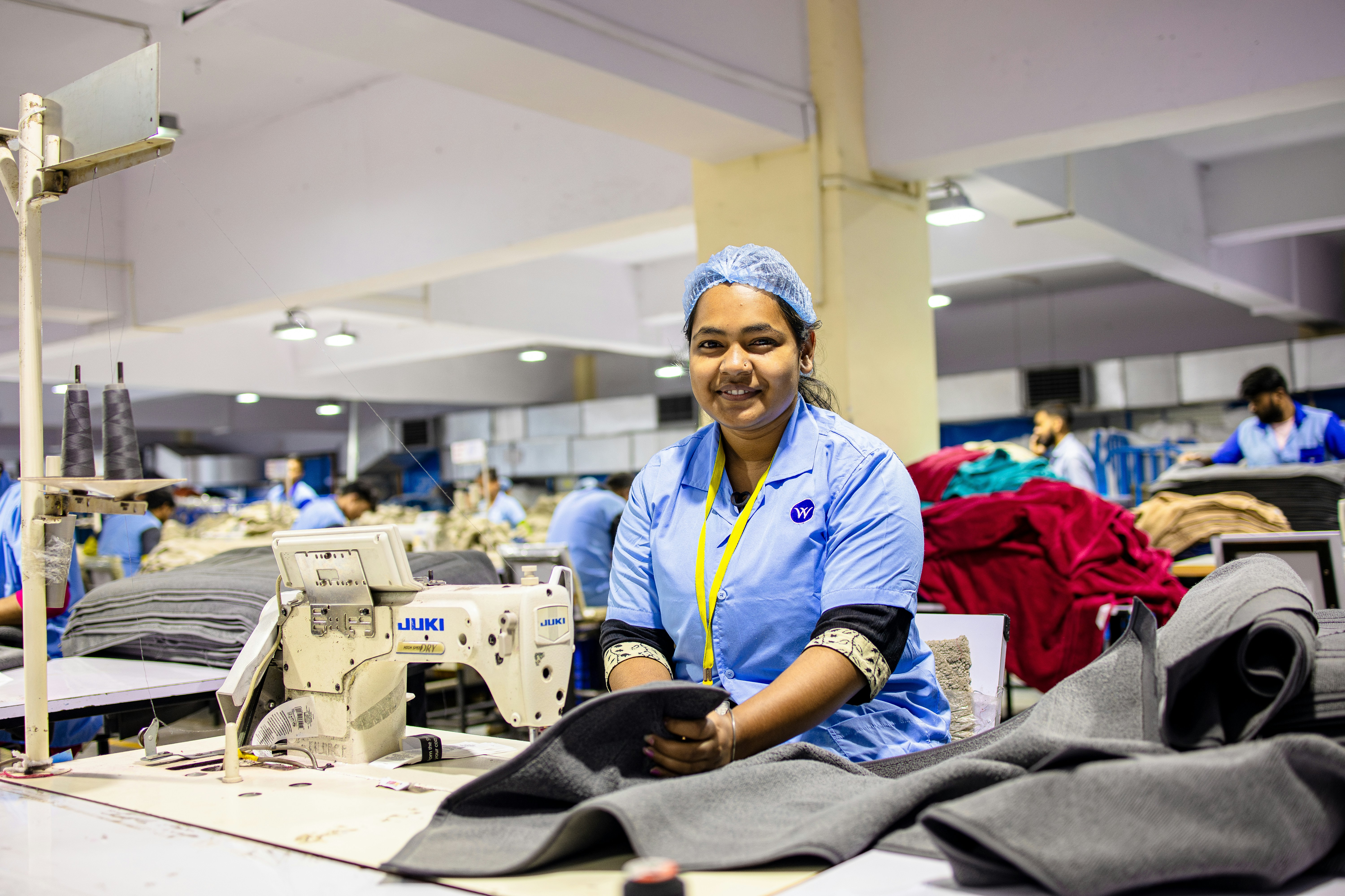 A woman works in a clothing factory - Free Photo on Unsplash