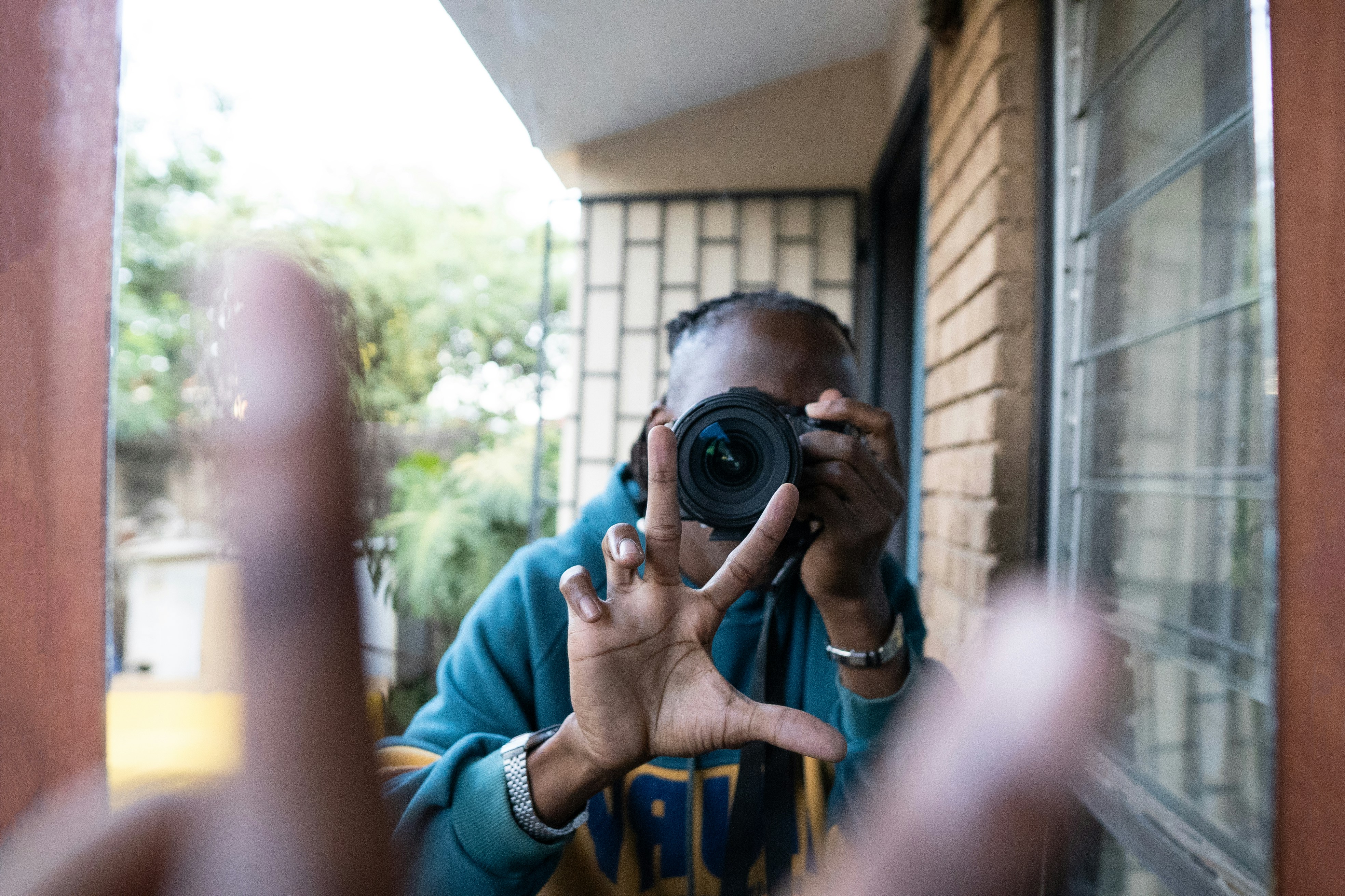 Person taking a photo in a mirror.