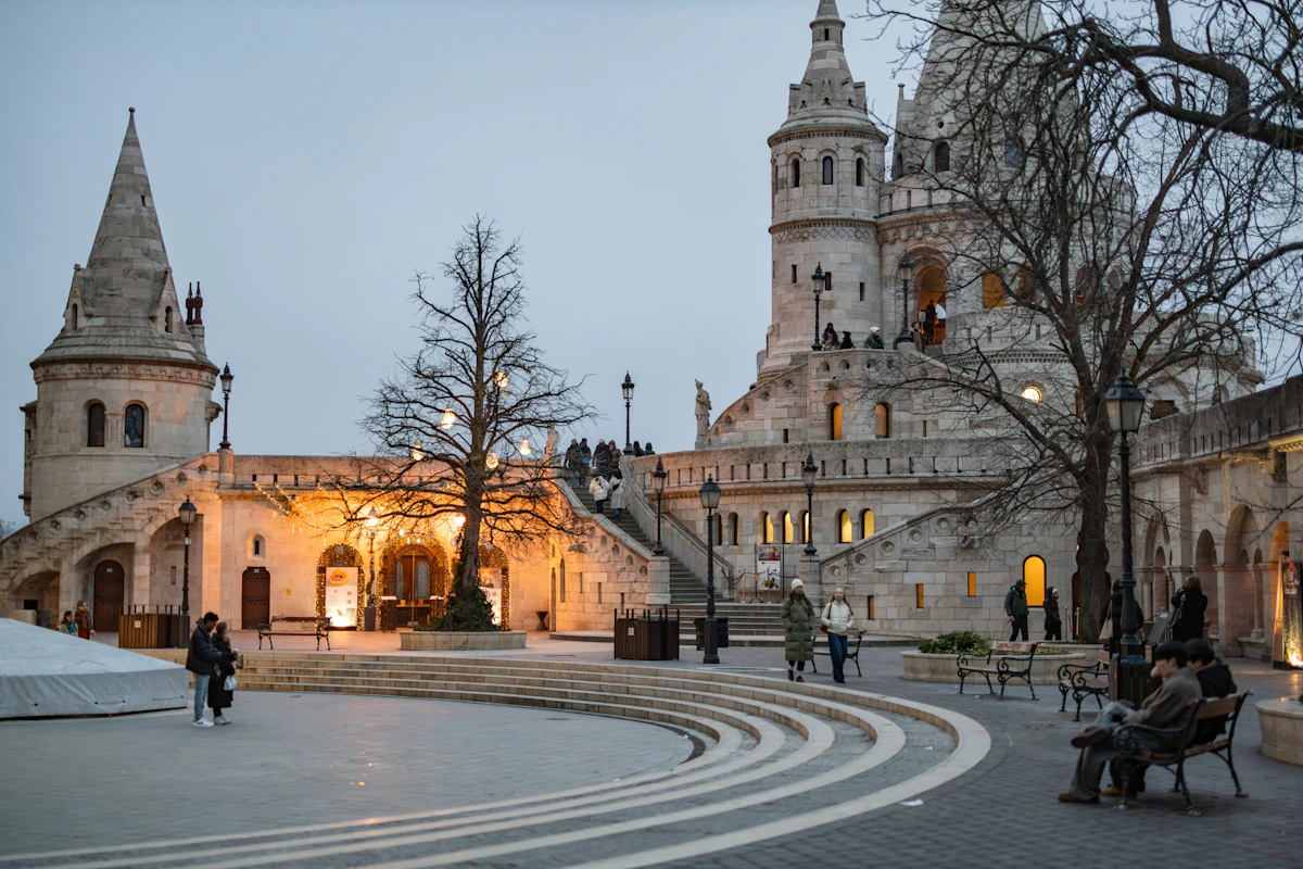 The pale stone arcades and towers of Fisherman's Bastion in Budapest on a winter evening
