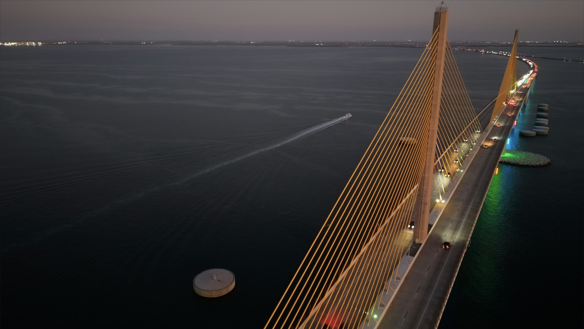 The sunshine skyway bridge stretches across the water.