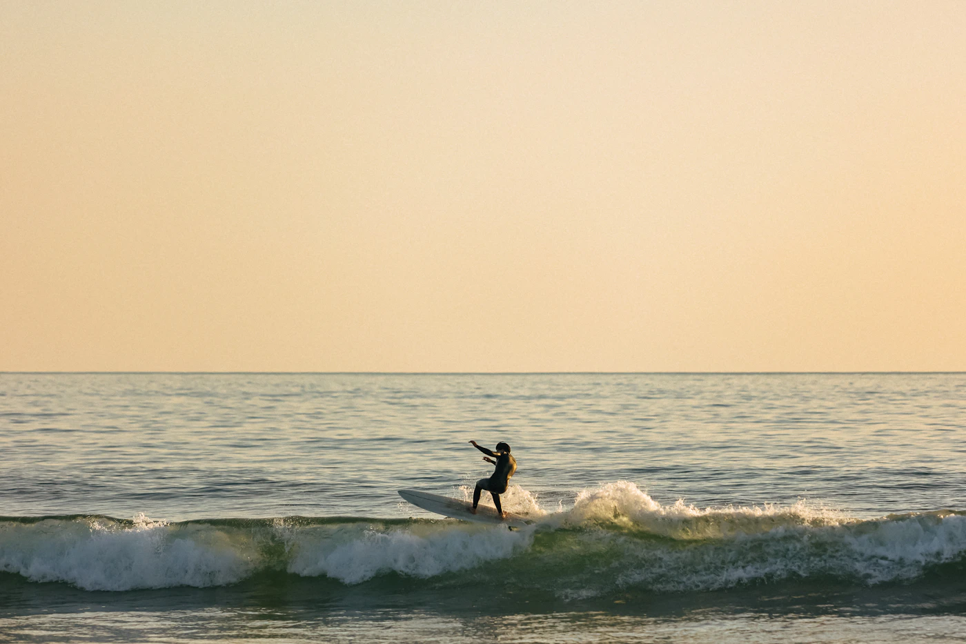 Surfer riding a powerful ocean wave
