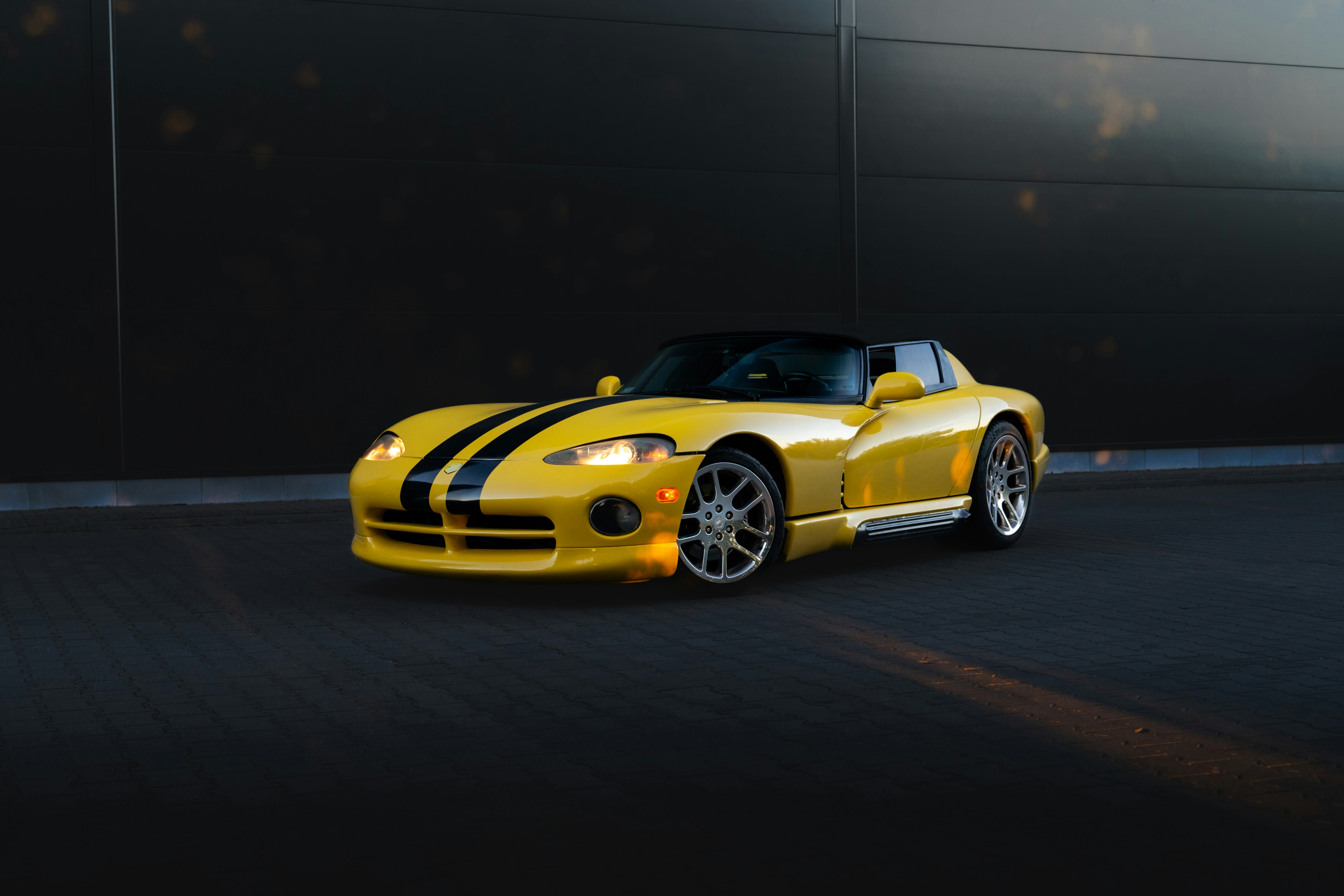 A yellow dodge viper sports car is pictured.