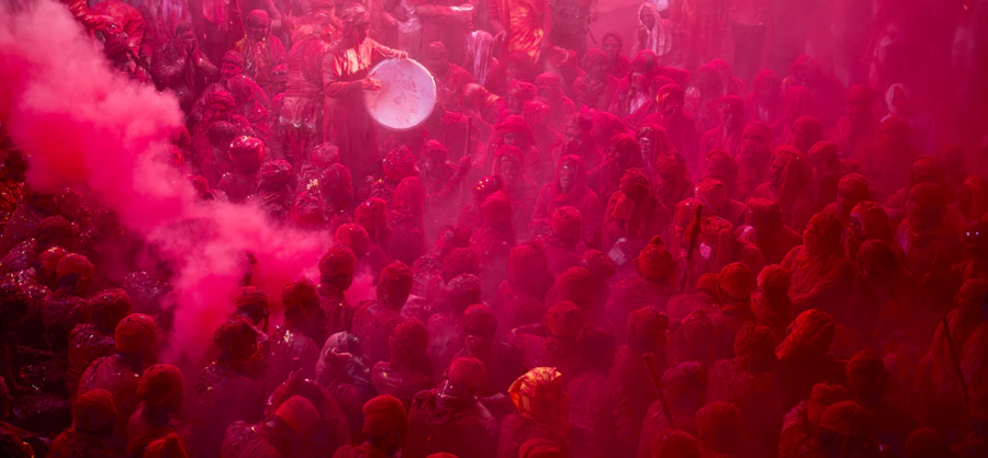 Pink colour in the air at a temple celebration