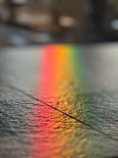 A rainbow spectrum reflected on a surface