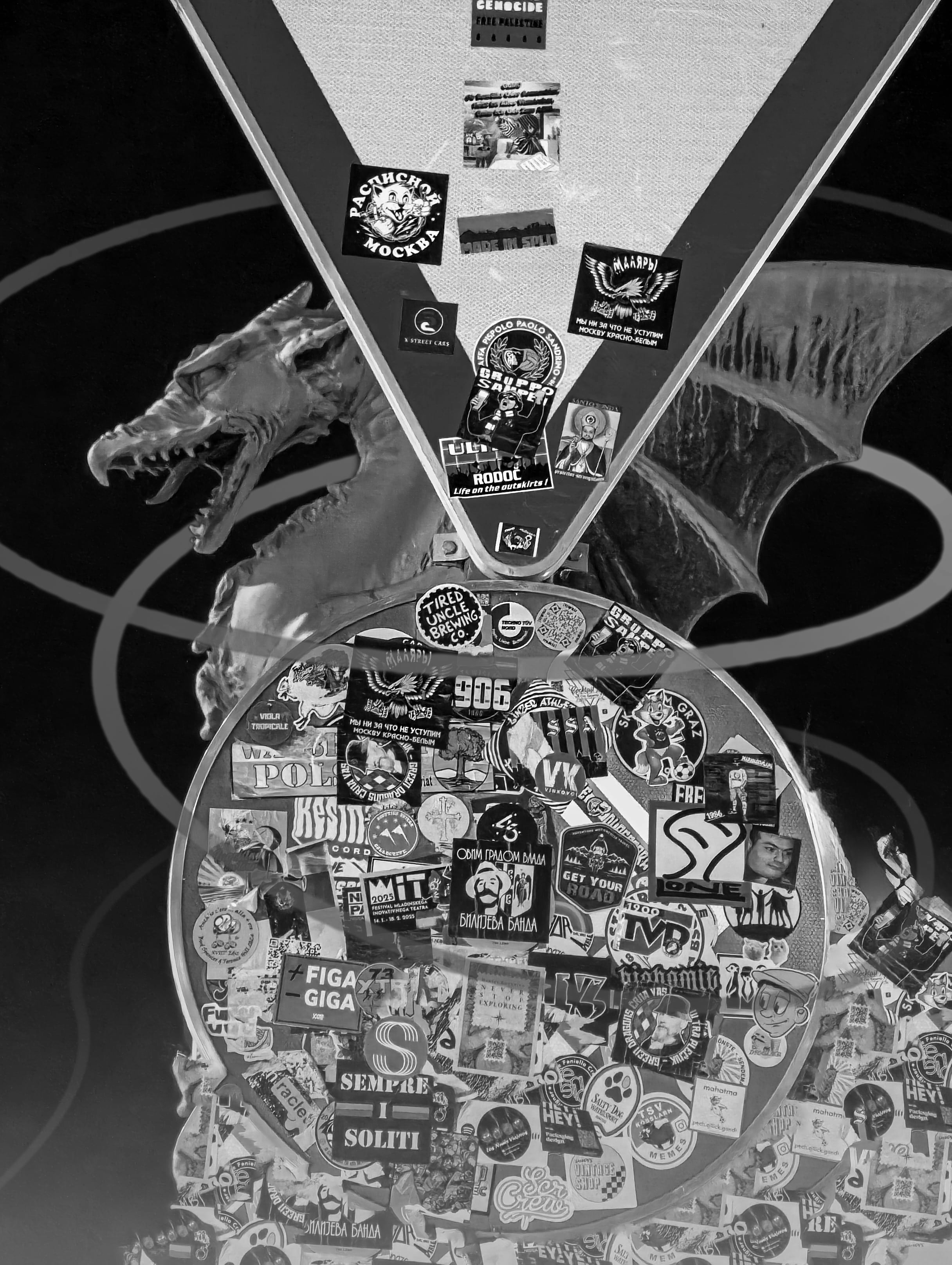 Dragon statue covered in stickers.