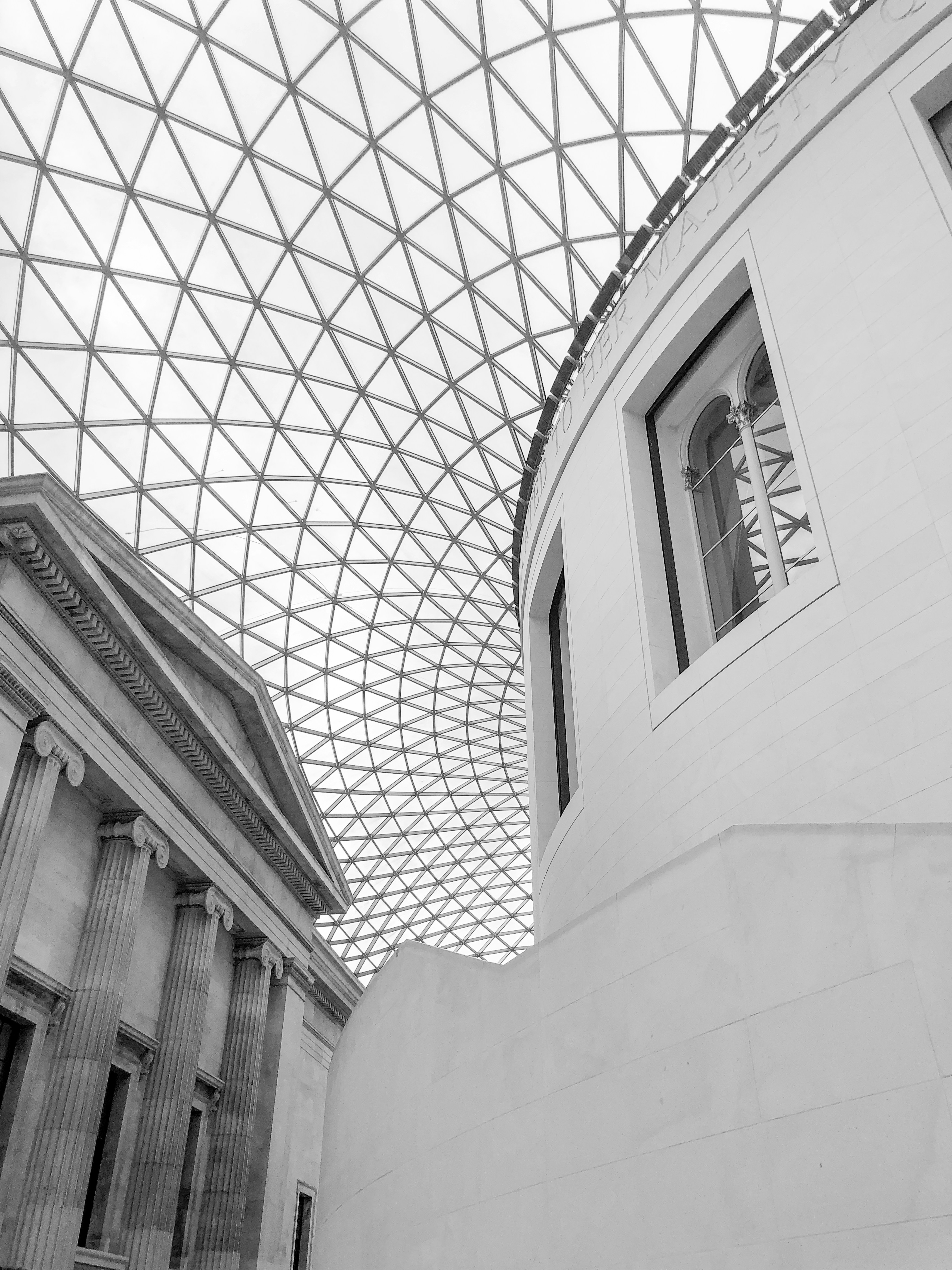 The british museum's glass roof and architecture.