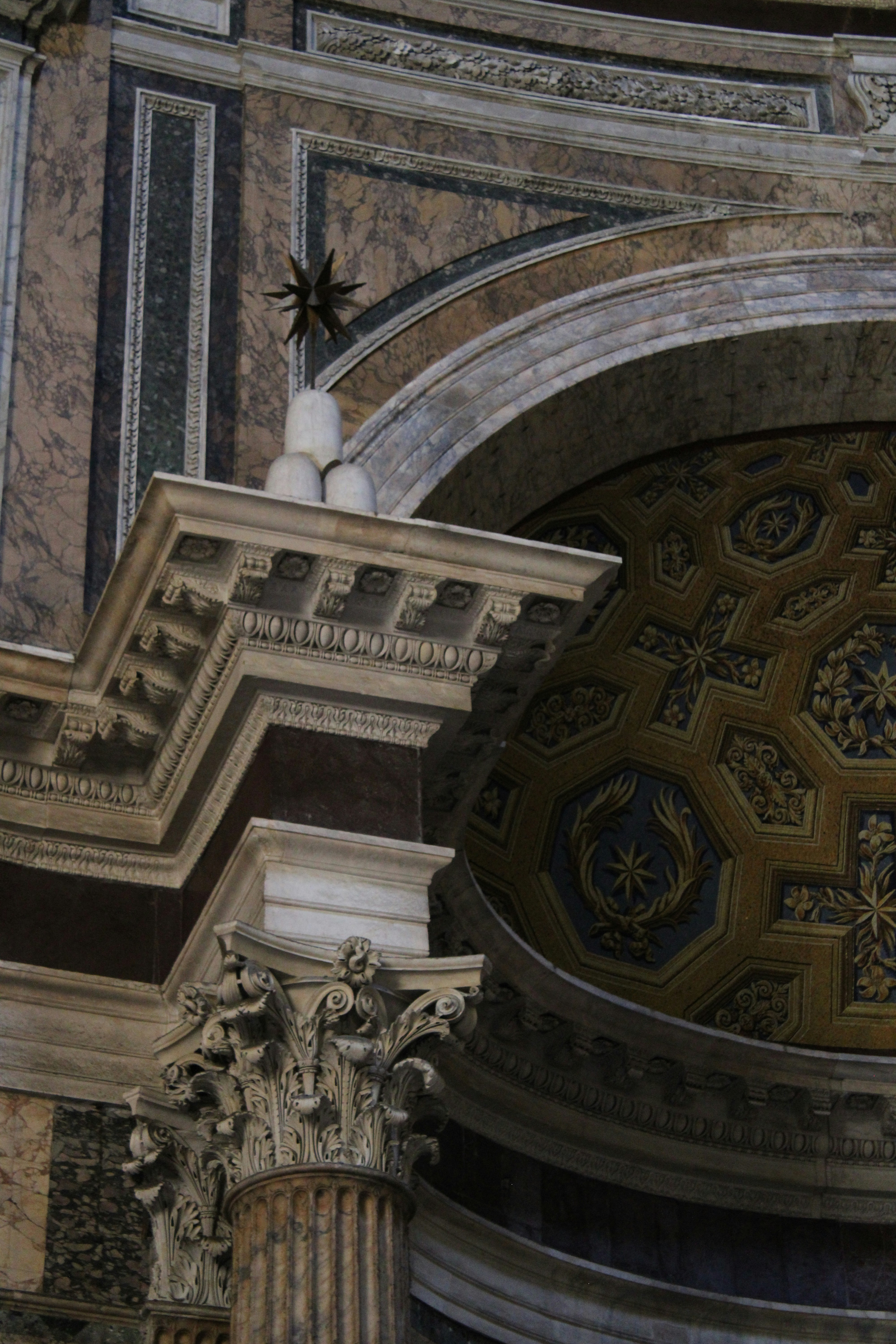 Architectural detail featuring a marble column and dome.