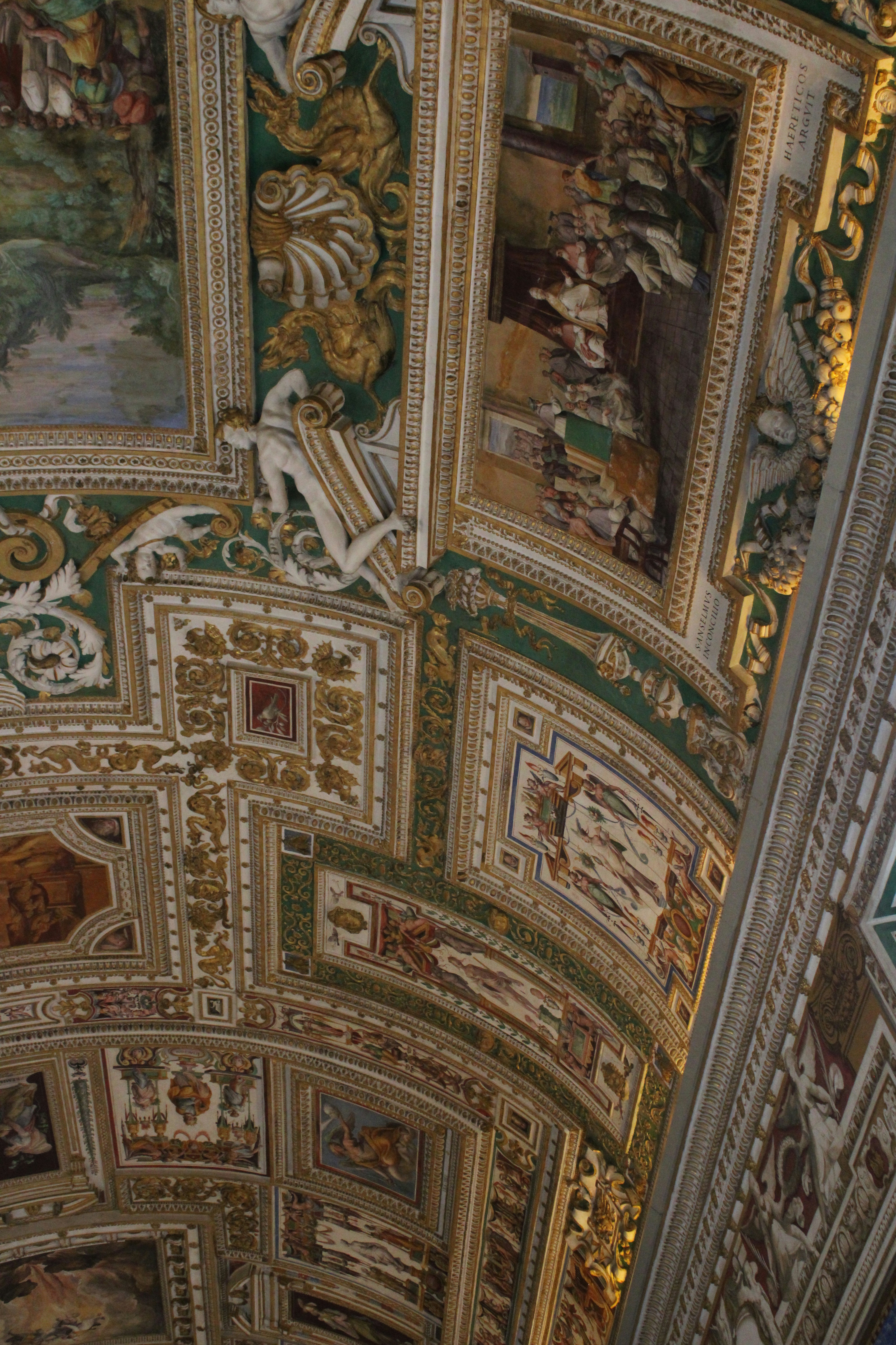 Elaborate ceiling frescoes with intricate designs.
