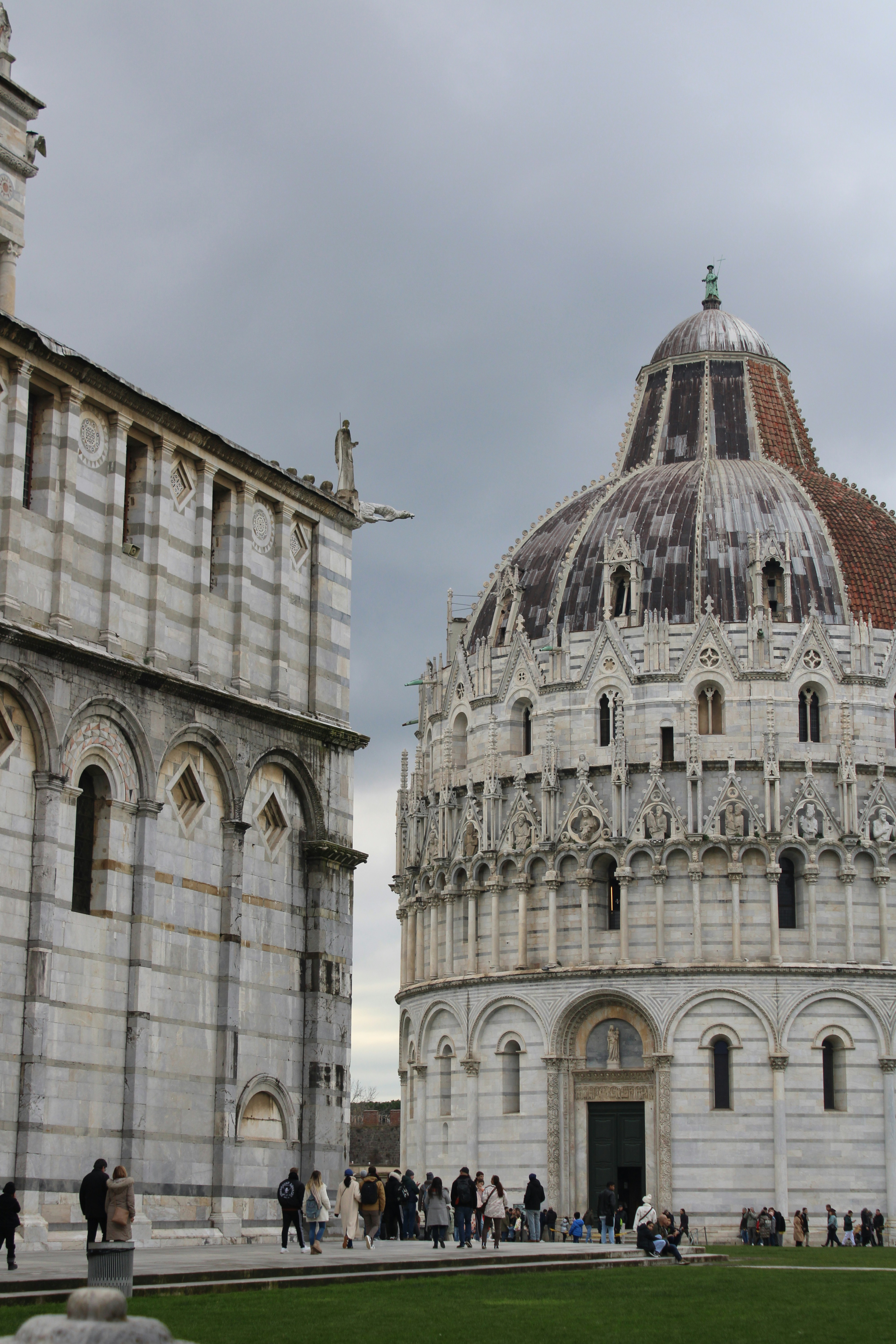 Two ancient italian buildings stand close to each other.