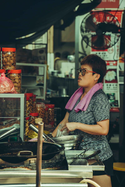 Malaysian small business owner running her local food stall