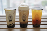 Brown sugar milk tea drinks in a row