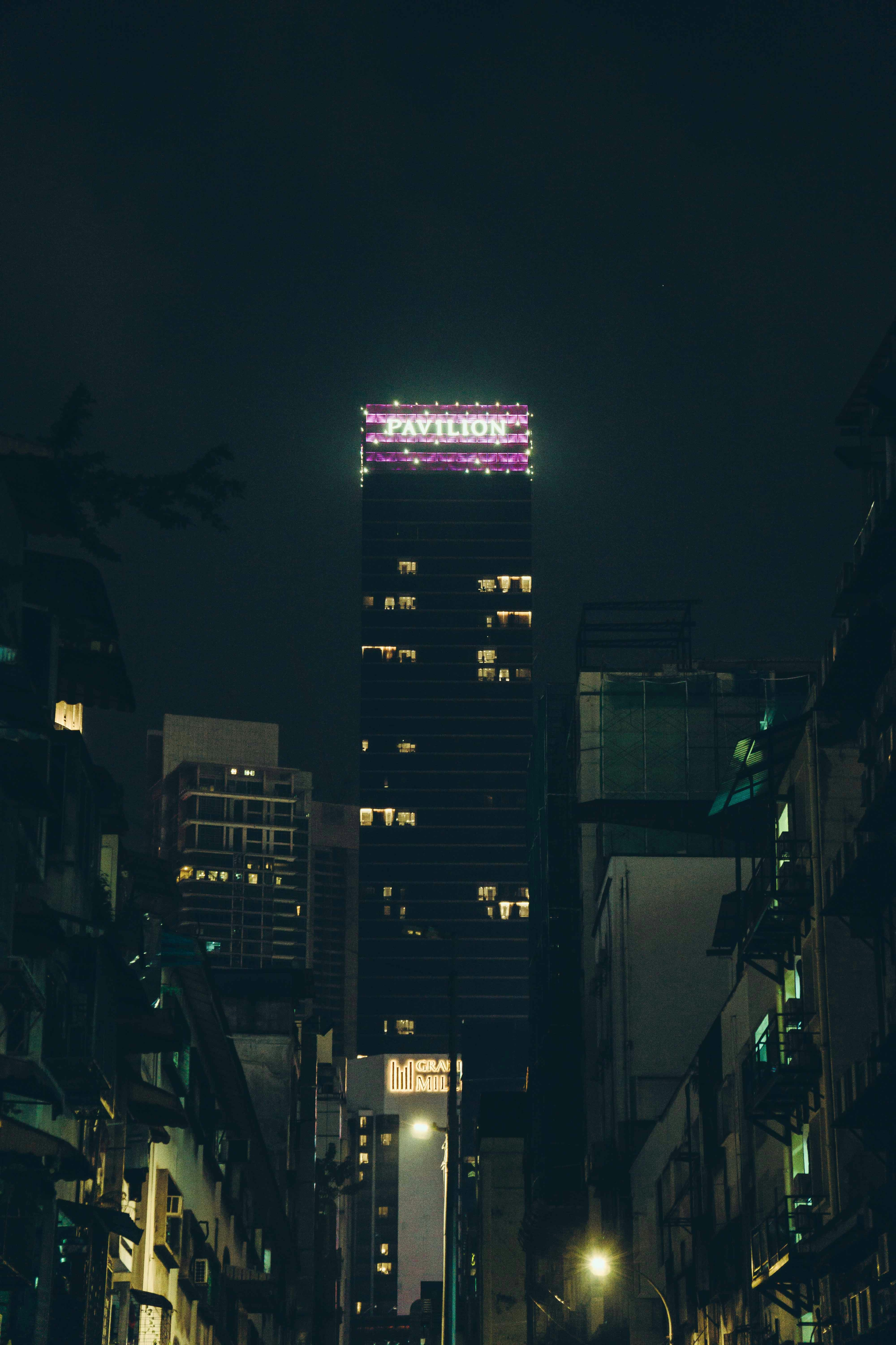 Night view of a tall city building.