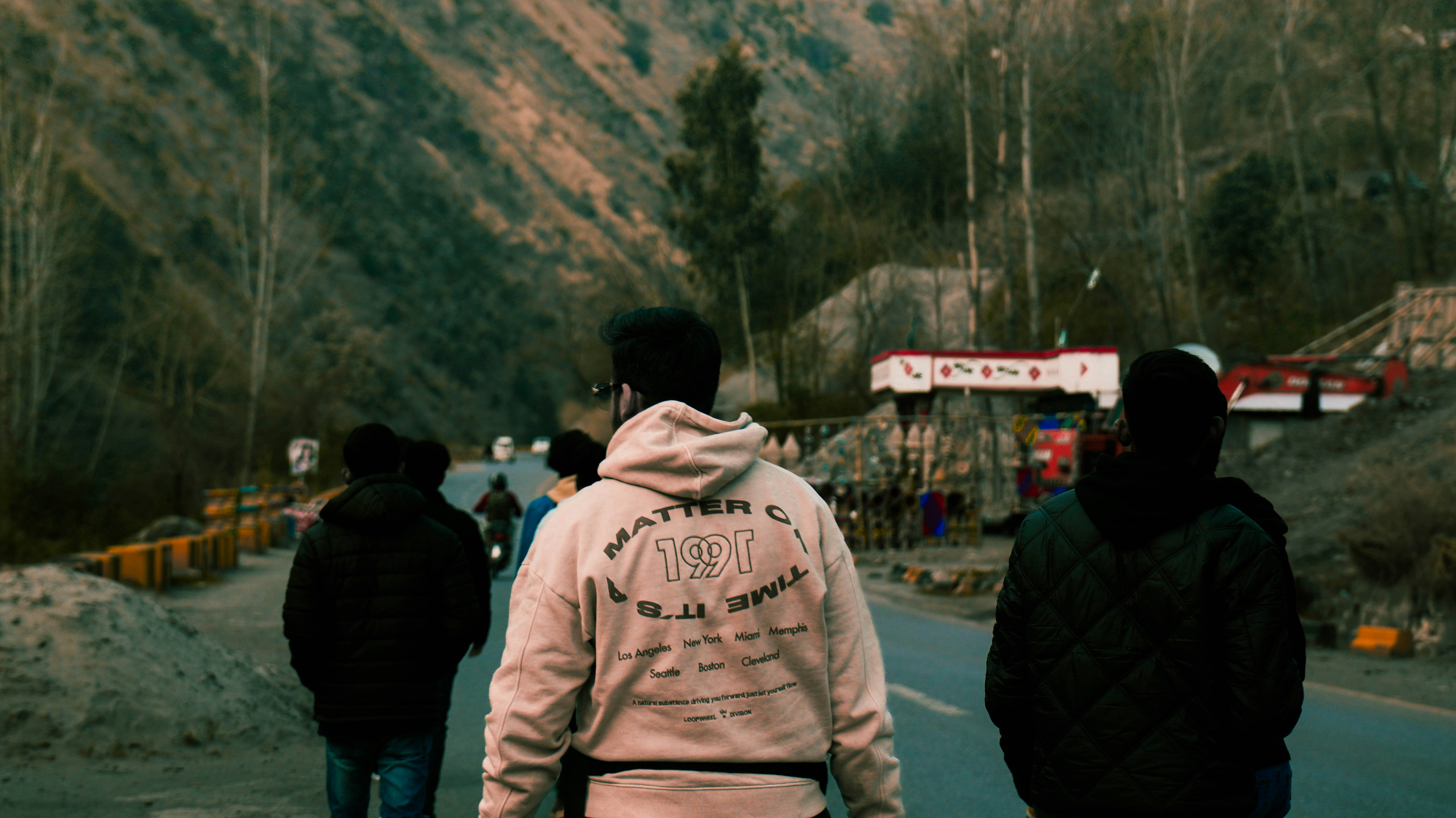 People walk on a mountain road.