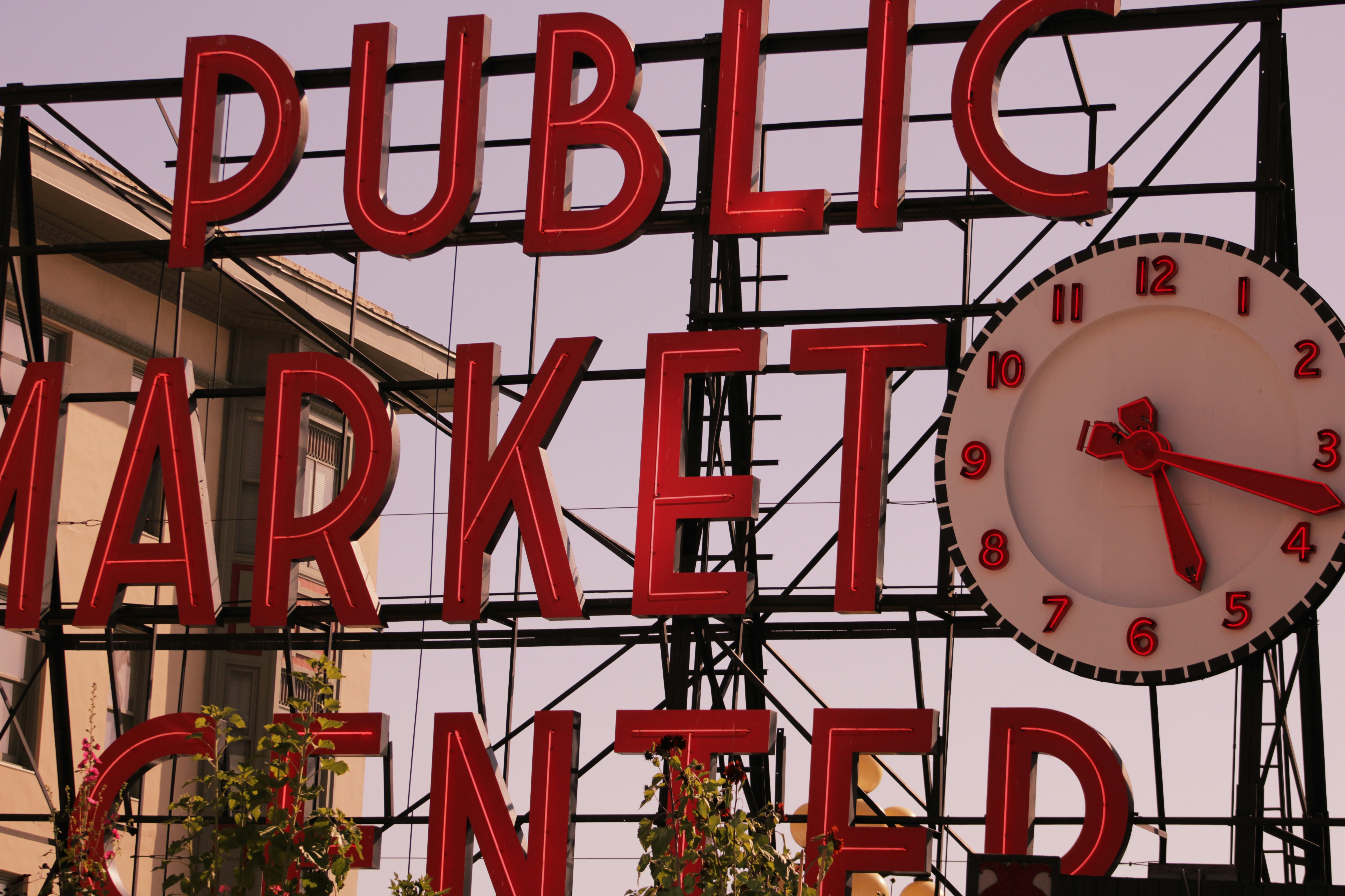 Public market center sign displays a clock.