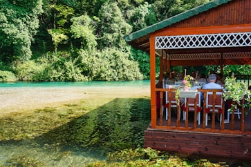 A restaurant is located next to a beautiful river.