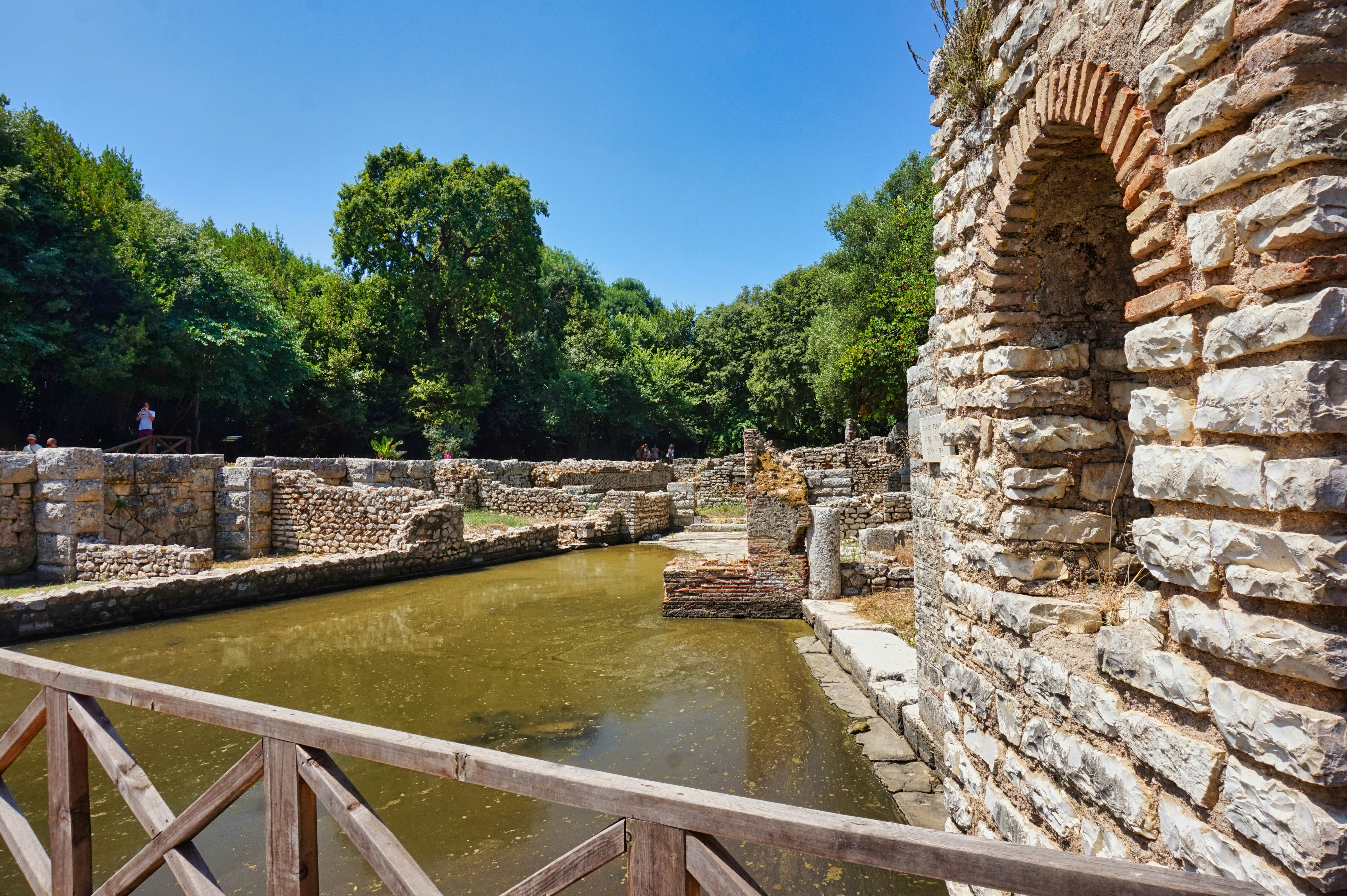 Ancient ruins and water on a sunny day.