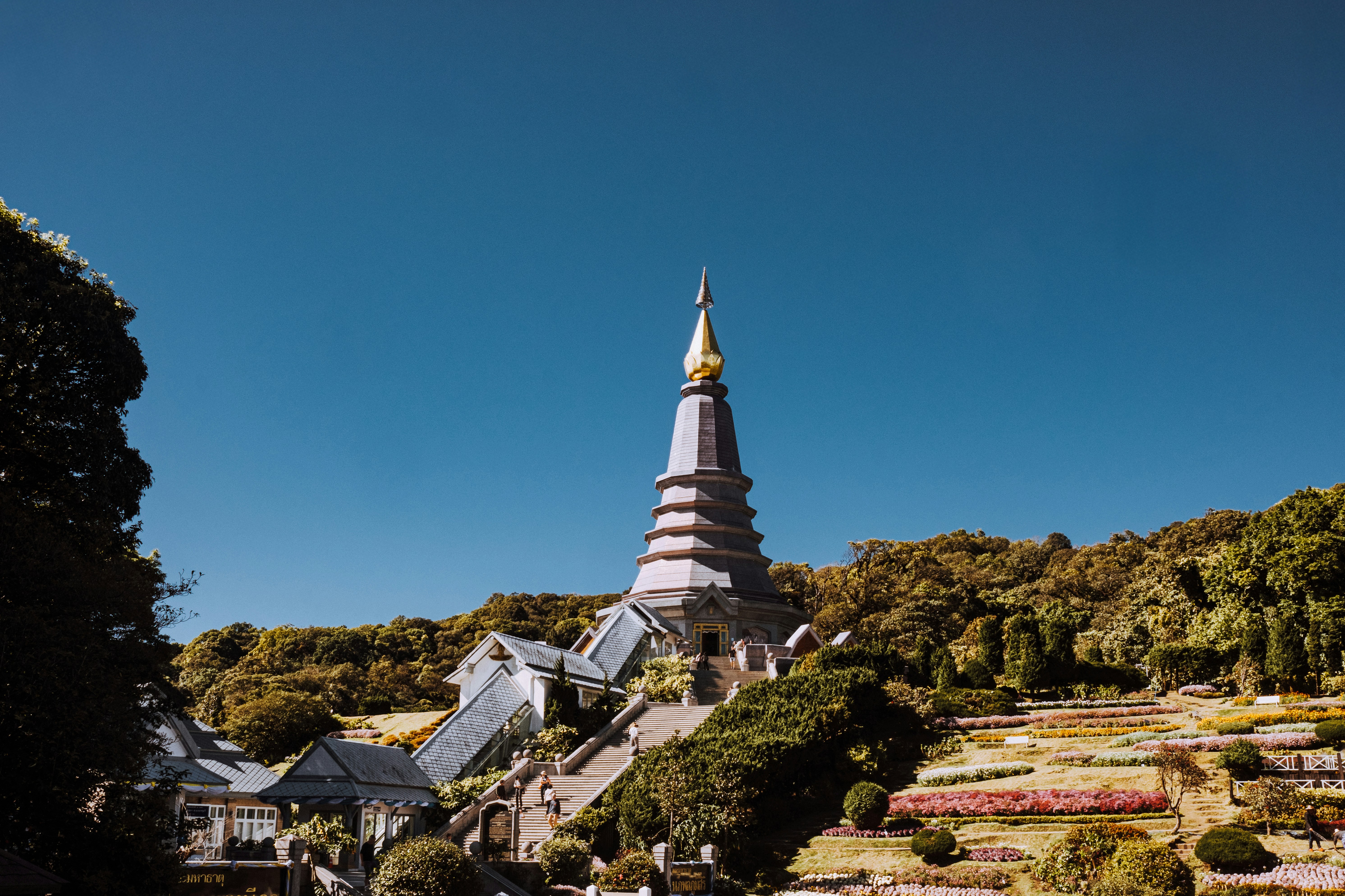 A temple stands tall under the clear, blue sky.
