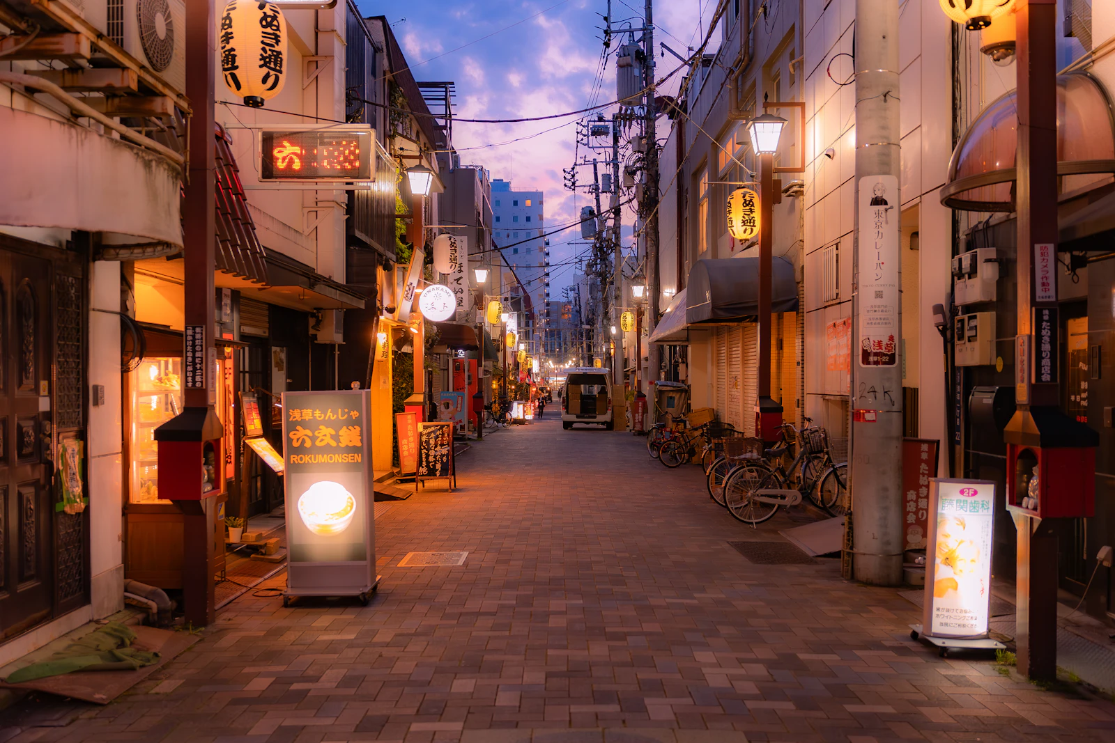Professionally lit city street at dusk showcasing architectural streetscape lighting