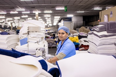 Woman sews clothes in a factory.