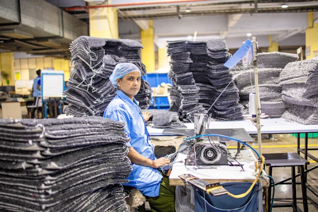 A woman works in a factory.