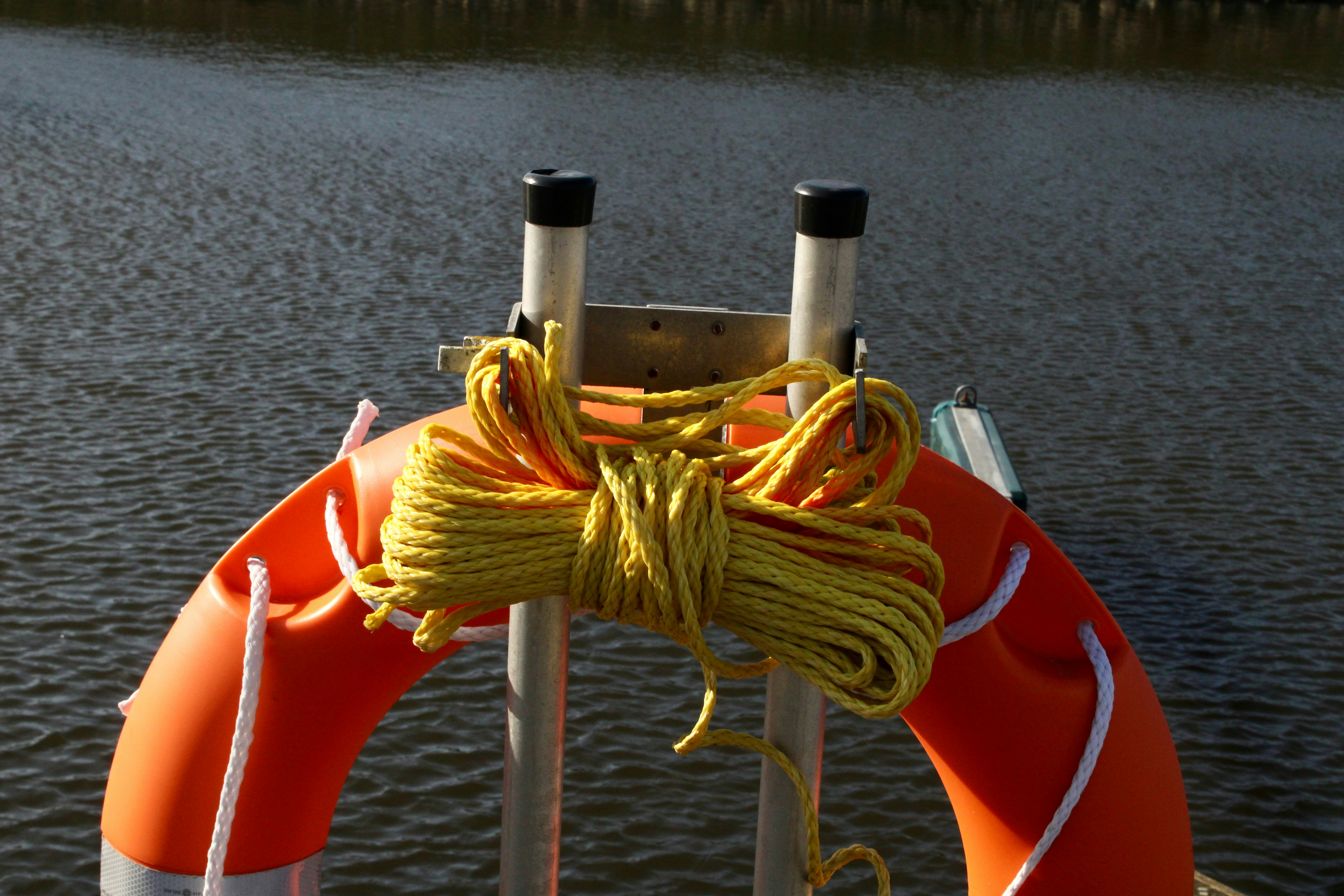 Life preserver with rope attached to a boat.