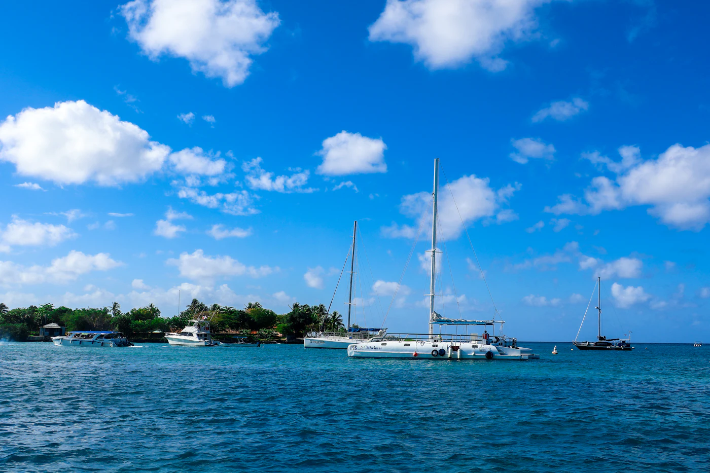 Sailing boats anchored on blue Caribbean water off Bayahibe
