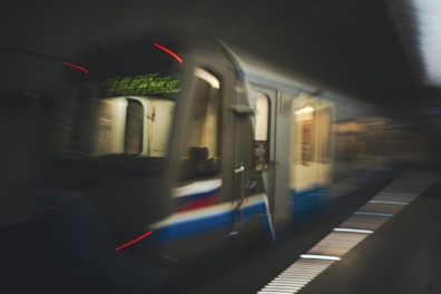 Subway train speeding through the station.