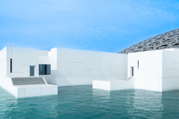 Louvre Abu Dhabi museum building beside the water on Saadiyat Island