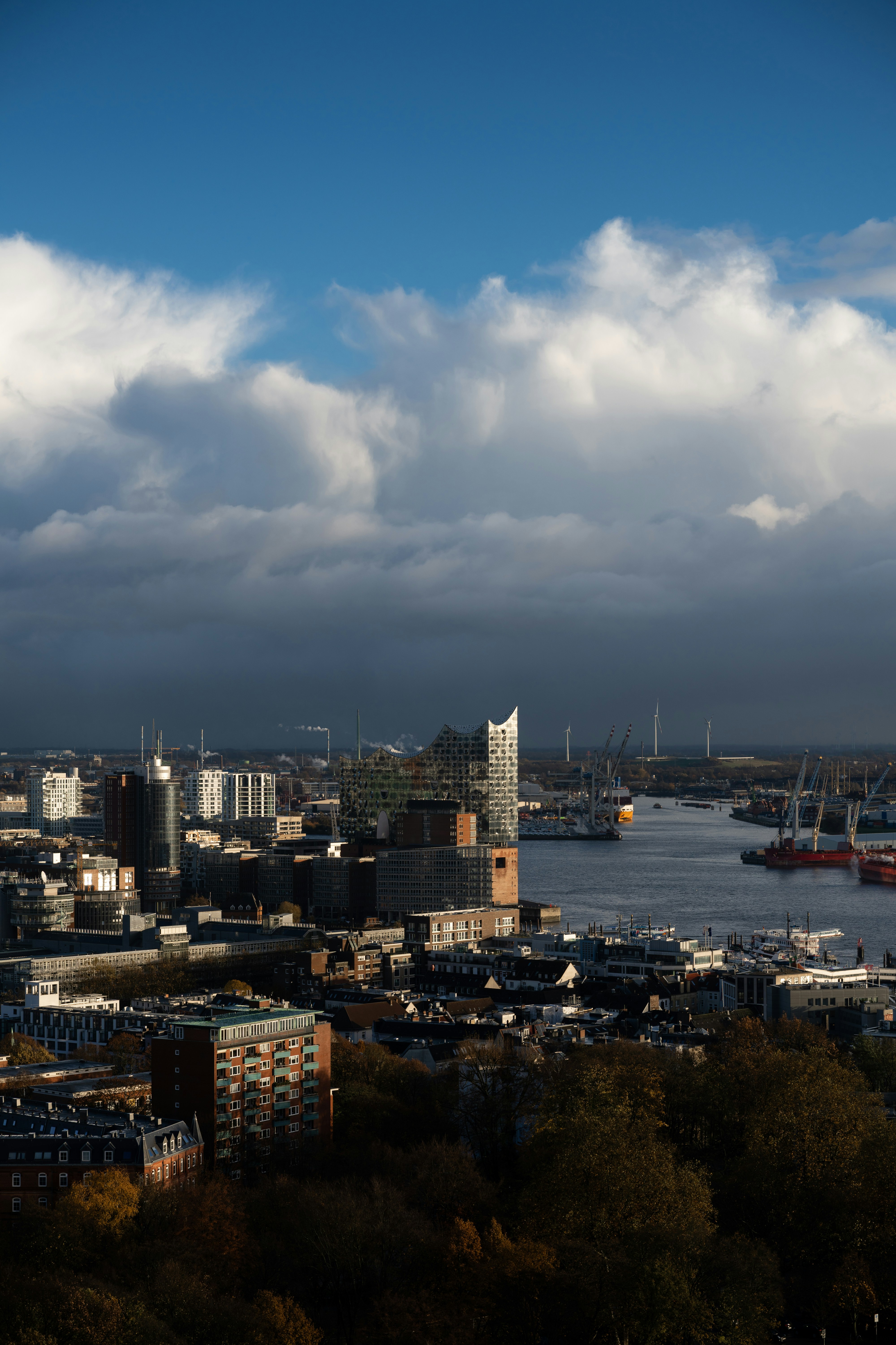Hamburg's cityscape sprawls under a dramatic sky.