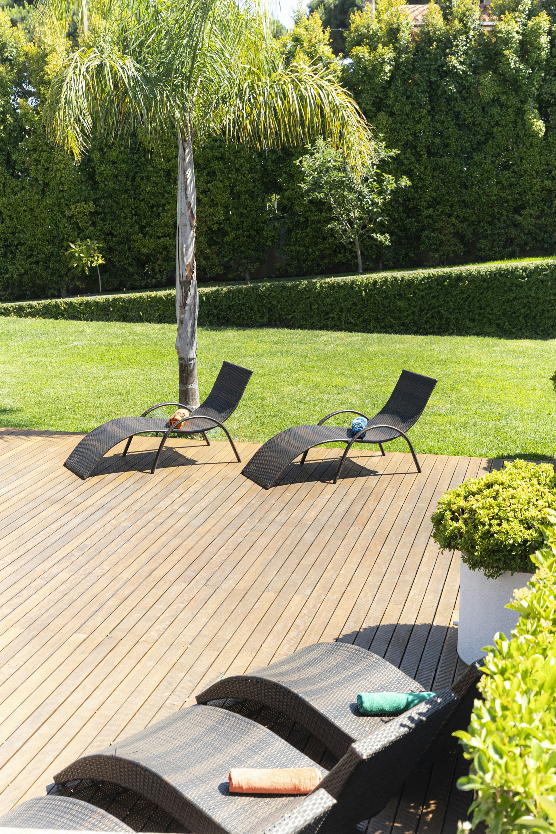 Lounge chairs await relaxation by the pool.