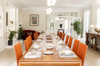 A dining room is prepared for a formal dinner.